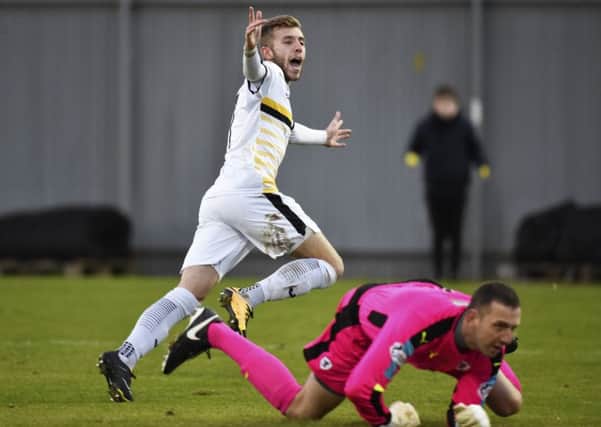 Dumbarton's Alistair Roy celebrates after scoring to make it 2-0. Picture: SNS/Rob Casey