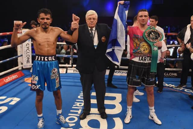 Josh Taylor (right) celebrates his win over Mexico's Miguel Vazquez to retain the WBC Super Lightweight title. Picture: Paul Devlin/SNS
