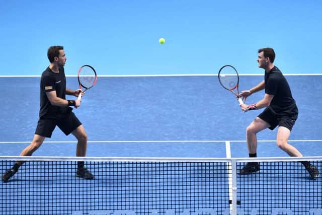 Jamie Murray (right) and Bruno Soares eye the ball against Bob and Mike Bryan during their doubles match at the ATP World Tour Finals at the O2 Arena in London. Picture: Glyn Kirk/AFP/Getty Images