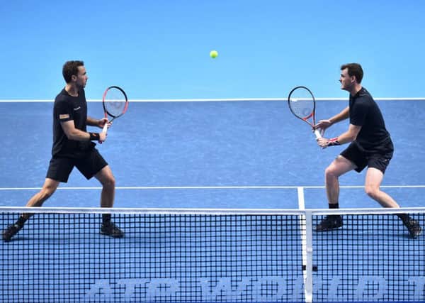 Jamie Murray (right) and Bruno Soares eye the ball against Bob and Mike Bryan during their doubles match at the ATP World Tour Finals at the O2 Arena in London. Picture: Glyn Kirk/AFP/Getty Images