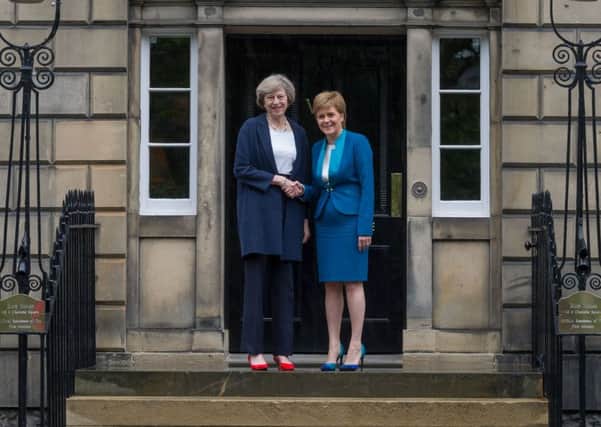 Nicola Sturgeon meets Theresa May at Bute House in 2016. Picture: Steven Scott Taylor/JP