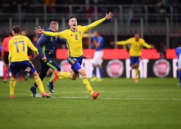 Mikael Lustig leads the celebrations after Sweden qualified thanks to a 1-0 aggregate victory. Picture: AFP/Getty Images