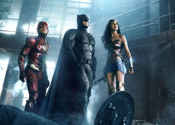 Ezra Miller as the Flash, Ben Affleck as Batman and Gal Gadot as Wonder Woman in Justice League