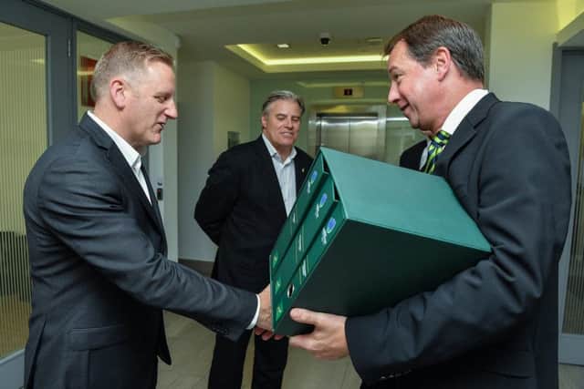 Jurie Roux hands over South Africa's bid to World Rugby CEO Brett Gosper and Rugby World Cup chief Alan Gilpin. Picture: Getty Images
