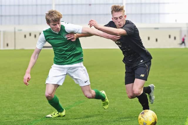 Callum Donaldson of Hibs takes on Celtic's Calvin Miller during a clash at the Oriam in Edinburgh. Picture: SNS Group