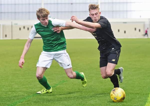 Callum Donaldson of Hibs takes on Celtic's Calvin Miller during a clash at the Oriam in Edinburgh. Picture: SNS Group