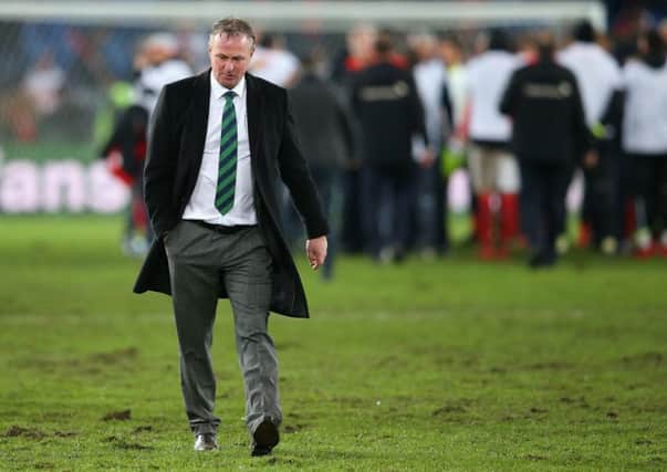 Michael O'Neill walks off the field after Northern Ireland's exit from the World Cup play-offs. Picture: Getty