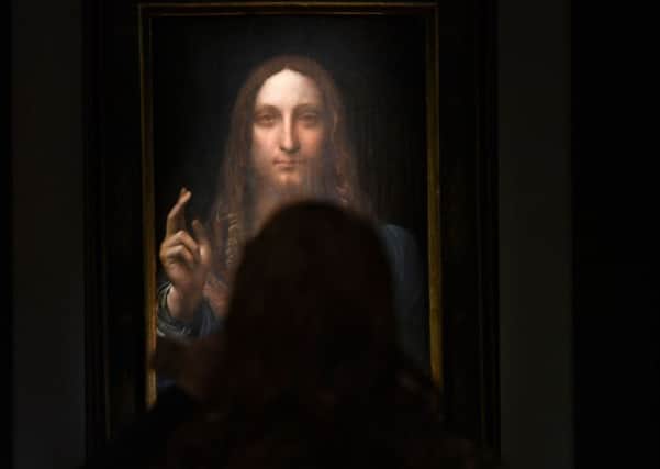 Leonardo da Vincis "Salvator Mundi" on display at Christie's in New York, TIMOTHY A. CLARY/AFP/Getty Images