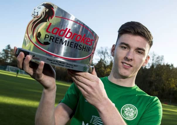 Kieran Tierney is presented with the Ladbrokes Premiership Player of the Month award for October. Picture: SNS Group
