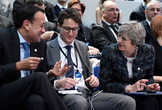Ireland's Prime minister Leo Varadkar (L) and Britain's Prime minister Theresa May (R) talk ahead a discussion session during the European Social Summit in Gothenburg, Sweden, on November 17, 2017. / AFP PHOTO / Jonathan NACKSTRANDJONATHAN NACKSTRAND/AFP/Getty Images
