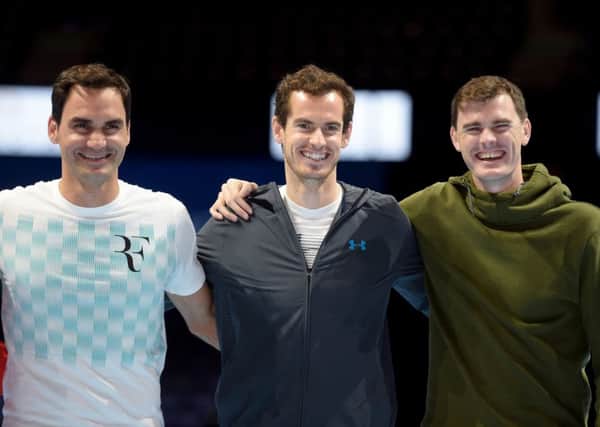 Sir Andy Murray flanked by his brother Jamie, right, and Roger Federer. Picture: John Devlin