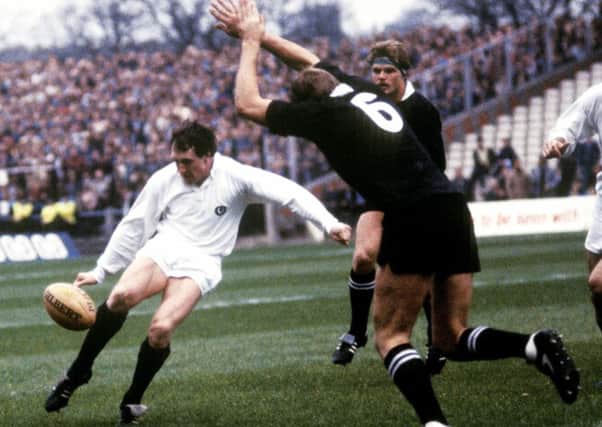 Scotland's Peter Dods, left, clears the ball as New Zealand's Mark Shaw closes in during the Test natch in 1983. Picture: SNS