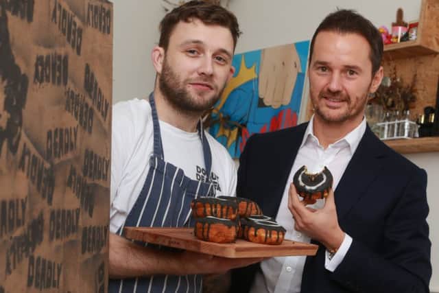 Freddie Spindler, left, founder of Deadly Donuts, with Princes Trust patron Mike Welch. Photograph: Stewart Attwood
