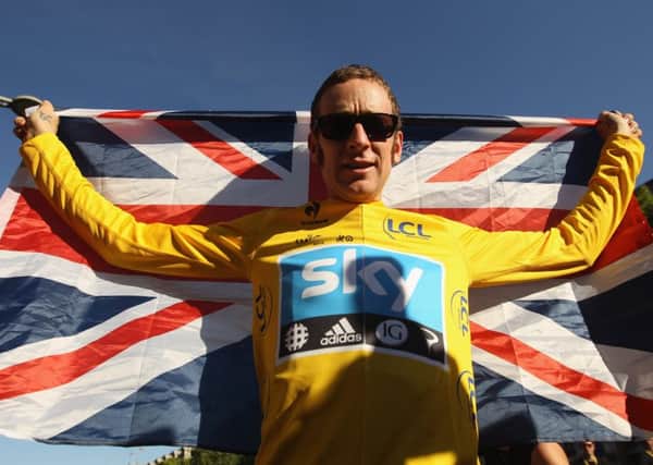 Sir Bradley Wiggins celebrates his Tour deFrance victory. Picture: Bryn Lennon/Getty Images