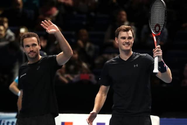 Jamie Murray, right, and Bruno Soares celebrate at the end of the victory over Lukasz Kubot and Marcelo Melo which put them into the last four. Picture: Adam Davy/PA Wire