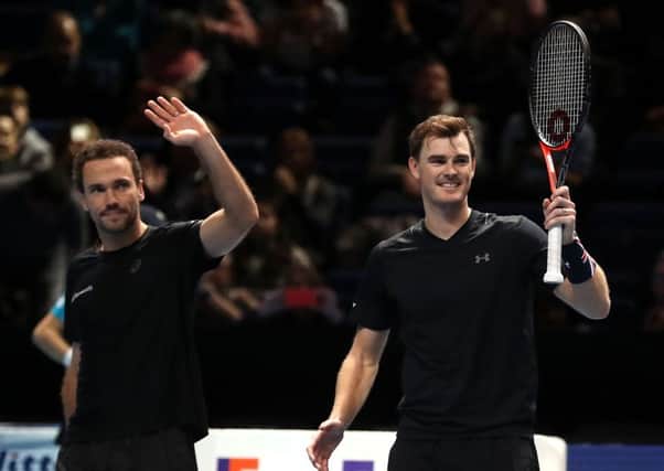 Jamie Murray, right, and Bruno Soares celebrate at the end of the victory over Lukasz Kubot and Marcelo Melo which put them into the last four. Picture: Adam Davy/PA Wire