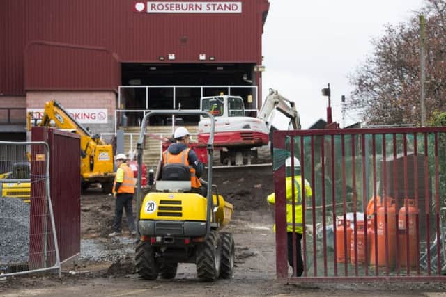 Work continues outside the Roseburn Stand where the Partick Thistle fans will be housed. Picture: SNS/Ross Parker