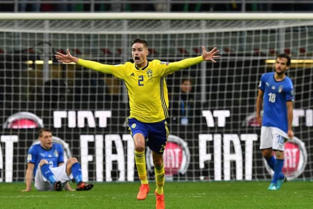 Just before doing his jaggy-arms dance, Mikael Lustig celebrates qualifying for his first World Cup finals as Sweden defied the odds in Italy. Photograph: Valerio Pennicino/Getty Images