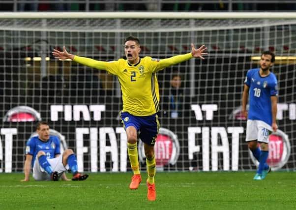 Just before doing his jaggy-arms dance, Mikael Lustig celebrates qualifying for his first World Cup finals as Sweden defied the odds in Italy. Photograph: Valerio Pennicino/Getty Images