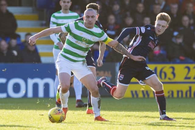Celtic's Scott Brown holds off Ross County's Davis Keillor-Dunn. Picture: SNS/Ross Parker