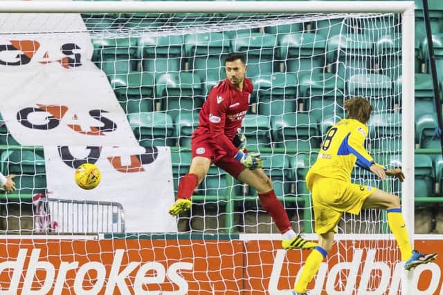 St Johnstone's Murray Davidson scores against Hibs to make it 1-0. Picture: SNS