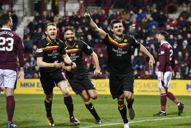 Kris Doolan celebrates his late equaliser for Partick Thistle. Picture: SNS