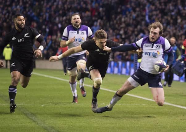 Scotland's Stuart Hogg is denied in the closing seconds by a try-saving tackle from Beauden Barrett. Picture: SNS/SRU