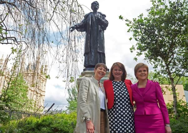 Nicola Sturgeon with Plaid Cymru leader Leanne Wood (centre), and Green Party co-leader Caroline Lucas (left) near a statue of the leading suffragette Emmeline Pankhurst (Picture: AFP/Getty Images)