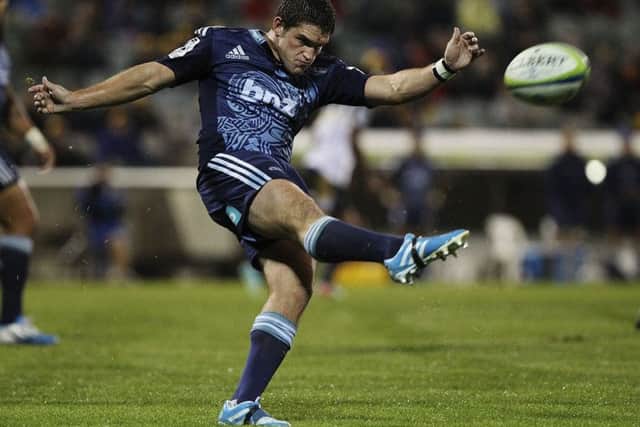 Simon Hickey of Blues kicks the ball during a Super Rugby match at Canberra Stadium in April  2014. Picture: Getty Images