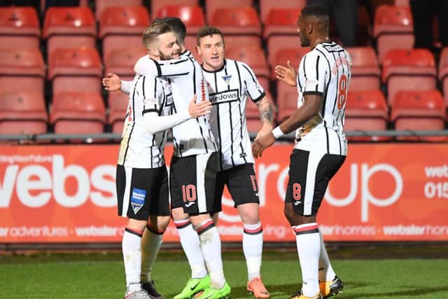 Dunfermlines Andy Ryan, left, celebrates his goal with team-mates during last nights 1-1 draw with Morton. Picture: SNS.