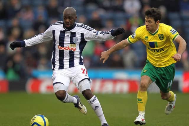 Youssouf Mulumbu holds off Wes Hoolahan of Norwich during a January 2012 match. Picture: Getty Images