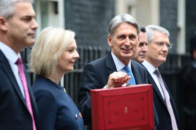 Chancellor Philip Hammond holds up the red box outside 11 Downing Street before going to make his budget speech  (Photo by Jack Taylor/Getty Images)