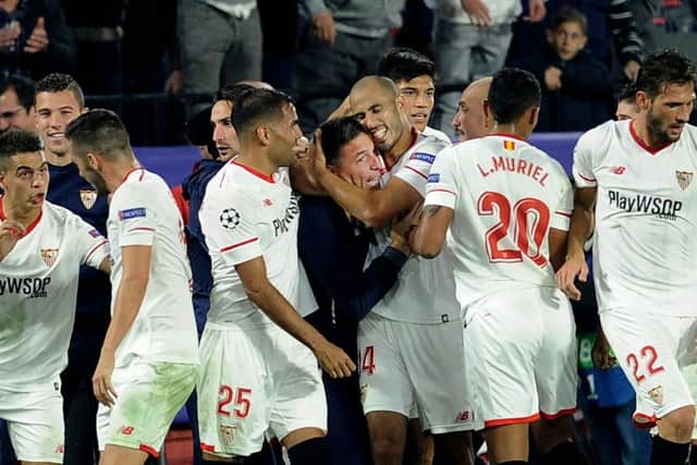 Guido Pizarro (R) celebrates with Eduardo Berizzo (L) after scoring a last-gasp equaliser against Liverpool. Picture: AFP/Getty Images