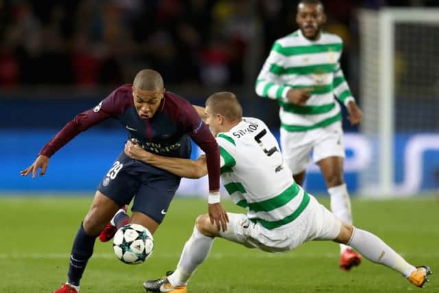 Jozo Simunovic resorts to desperate measures in a bid to halt the progress of Kylian Mbappe. Picture: Getty Images