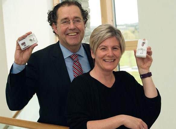 Cornelius Glismann of CorporateHealth with his first Inverness employee Lesley Patience