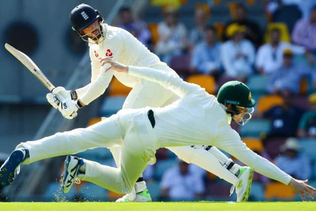 Australia fielder Cameron Bancroft dives for a shot by England batsman James Vince. Picture: Patrick Hamilton/AFP/Getty Images