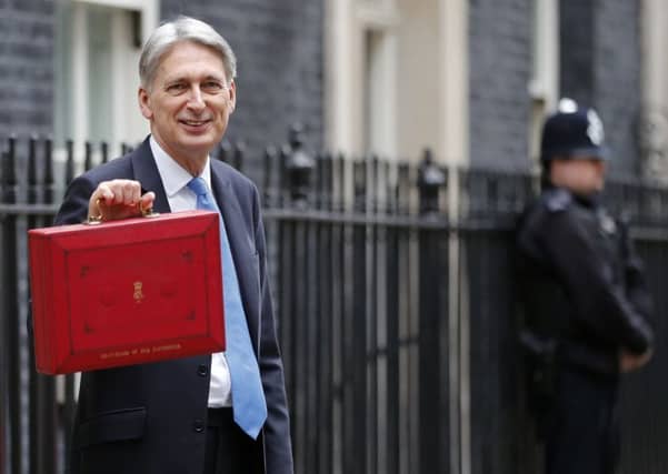 Chancellor of the Exchequer Philip Hammond says the UK has dropped out of the world's top five economies. Picture: AP Photo/Frank Augstein