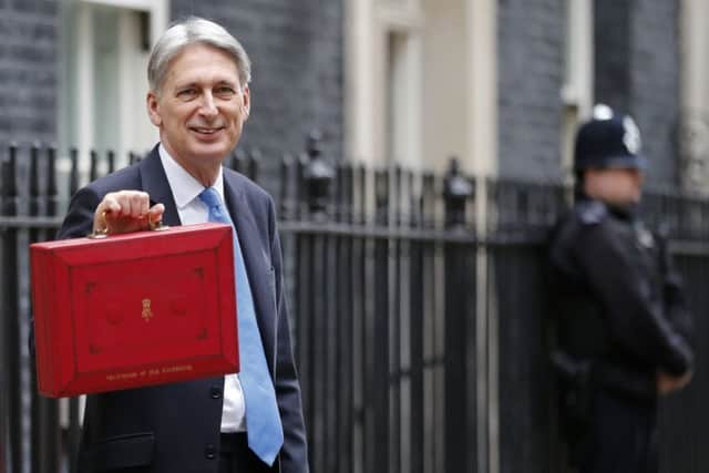 Chancellor of the Exchequer Philip Hammond says the UK has dropped out of the world's top five economies. Picture: AP Photo/Frank Augstein
