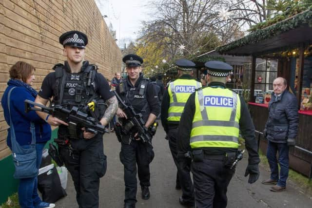 Armed police on patrol during Edinburghs Christmas Market in Princes Street Gardens last year. Picture: SWNS