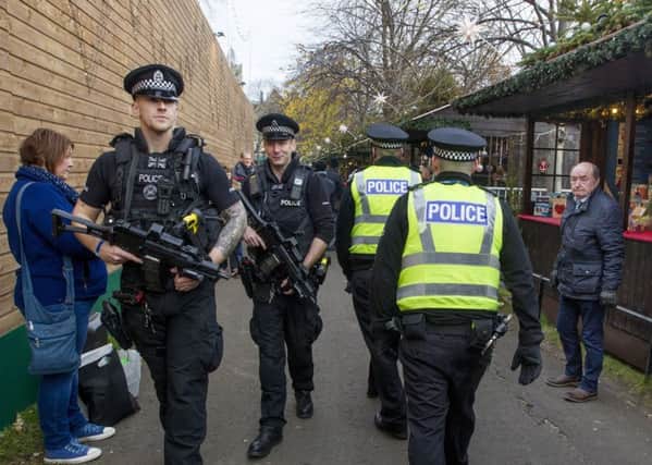 Armed police on patrol during Edinburghs Christmas Market in Princes Street Gardens last year. Picture: SWNS