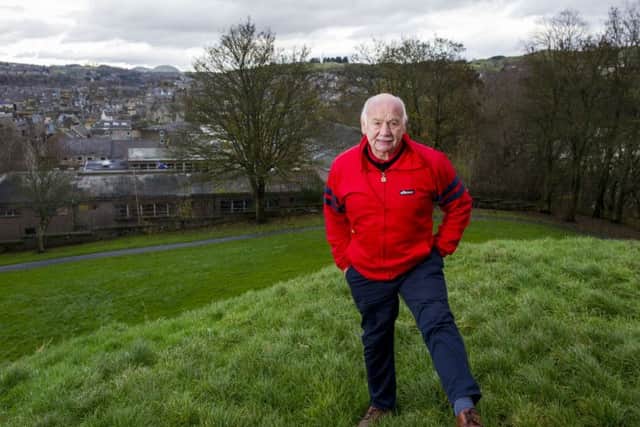 Jim Renwick at the top of Moat Hill with his beloved Hawick and the Borders hills in the background. Picture: Ian Rutherford