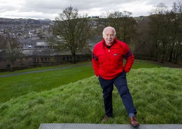 Jim Renwick at the top of Moat Hill with his beloved Hawick and the Borders hills in the background. Picture: Ian Rutherford
