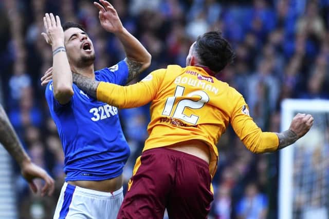 Motherwell's Ryan Bowman's challenge on Fabio Cardoso left the Rangers defender with a broken nose in the Betfred Cup semi-final. Picture: Rob Casey/SNS