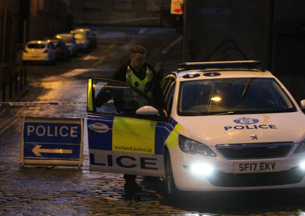 A police officer at the scene of the rape in Dundee. Photograph: DC Thomson