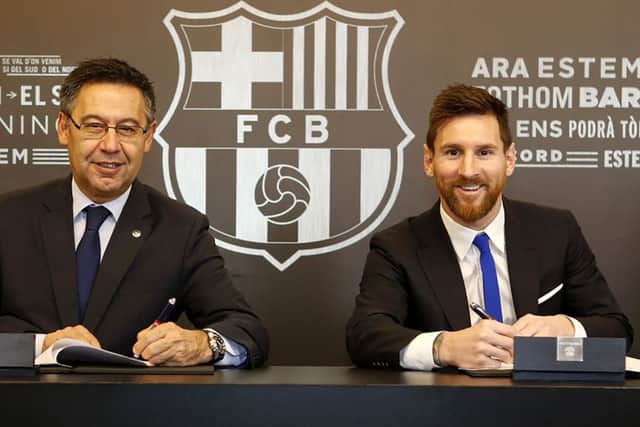 Barcelona FC President Josep Maria Bartomeu and Lionel Messi signing a contract extension keeping Messi at Barcelona until 2021.
FC Barcelona. Picture: BARCELONA FC PRESS OFFICE / HOHO/AFP/Getty Images