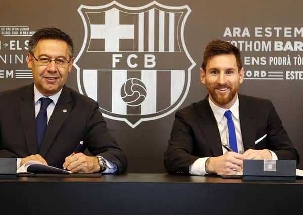 Barcelona FC President Josep Maria Bartomeu and Lionel Messi signing a contract extension keeping Messi at Barcelona until 2021.
FC Barcelona. Picture: BARCELONA FC PRESS OFFICE / HOHO/AFP/Getty Images