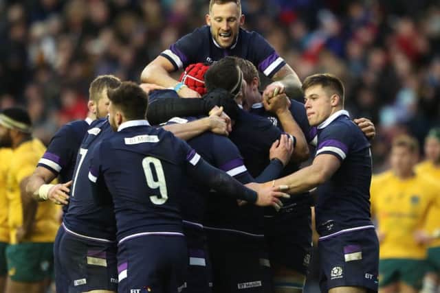 Scotland's Byron McGuigan (top) celebrates Jonny Gray's try. Picture: Andrew Milligan/PA Wire