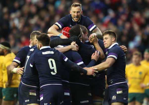 Scotland's Byron McGuigan (top) celebrates Jonny Gray's try. Picture: Andrew Milligan/PA Wire