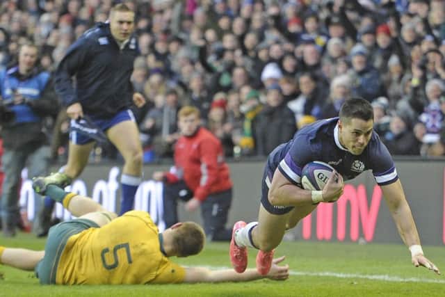 Sean Maitland scores Scotland's third try in the corner as 14-man Australia are thumped at Murrayfield. Picture: Neil Hanna