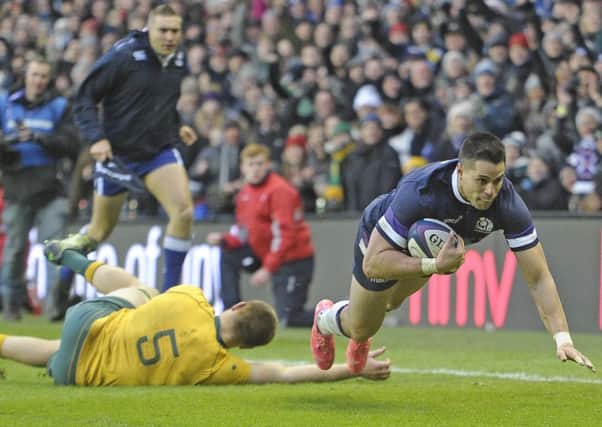 Sean Maitland scores Scotland's third try in the corner as 14-man Australia are thumped at Murrayfield. Picture: Neil Hanna